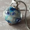 Pendentif perle ronde en verre filé au chalumeau.Inspiration planète.**P241**
