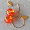 Boucles d'oreilles perles "donut" en verre filé orange transparent ** Bo117**